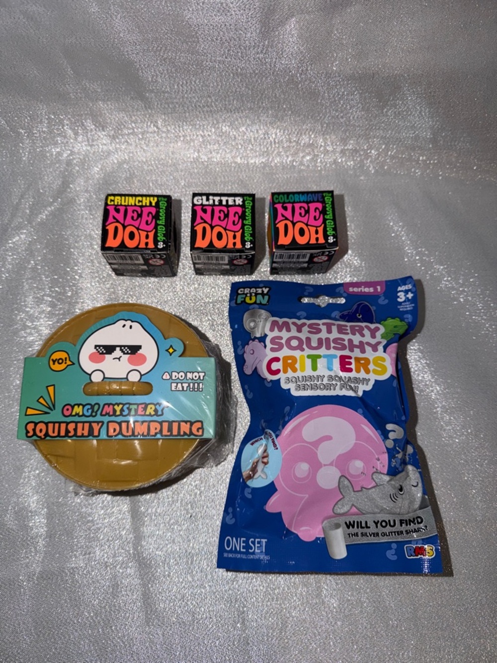 1 NeeDoh, 1 OMG Mystery Dumpling & 2 Crazy Fun Squishy Critters Mystery Bags